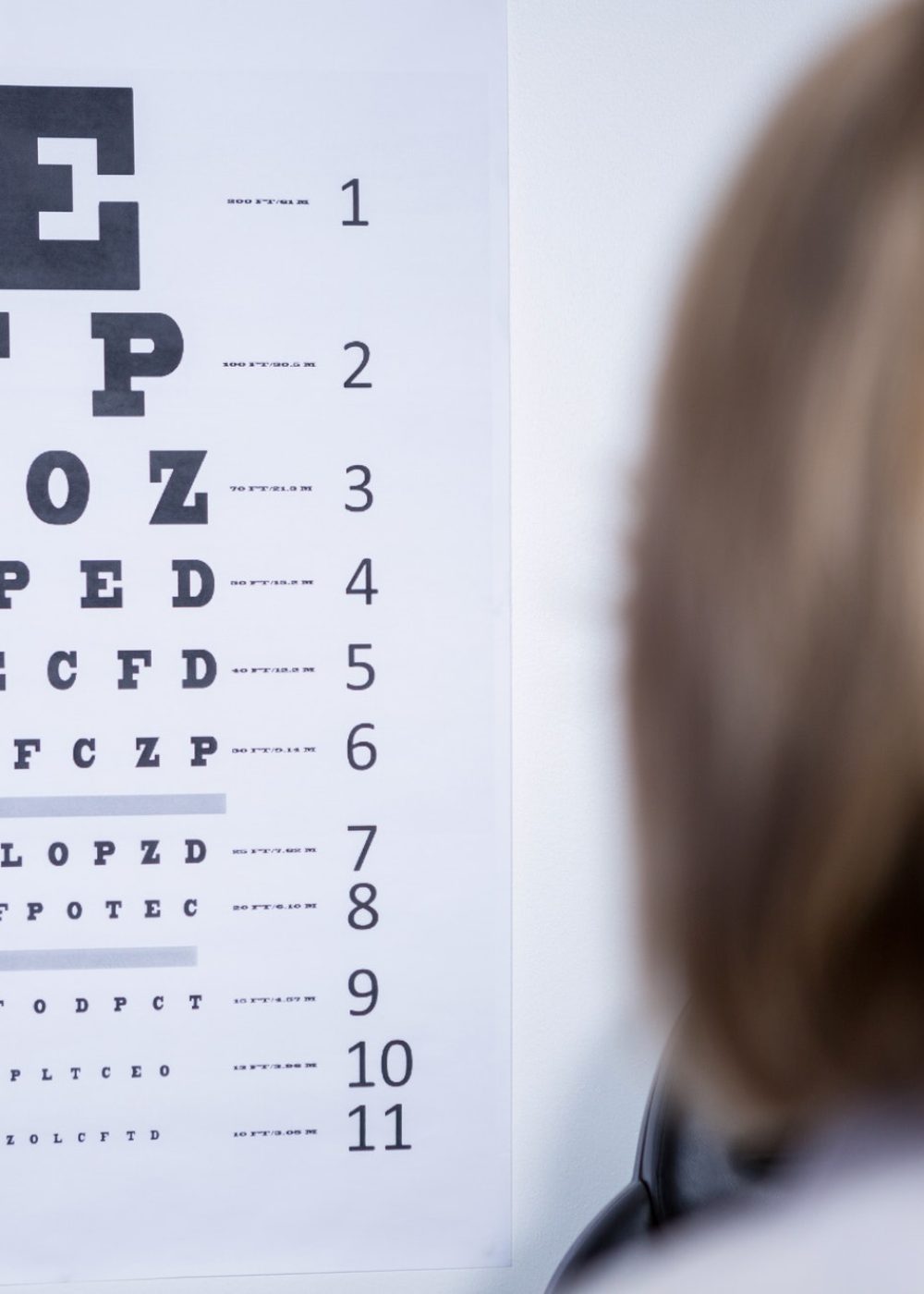 optometrist-looking-at-eye-chart.jpg